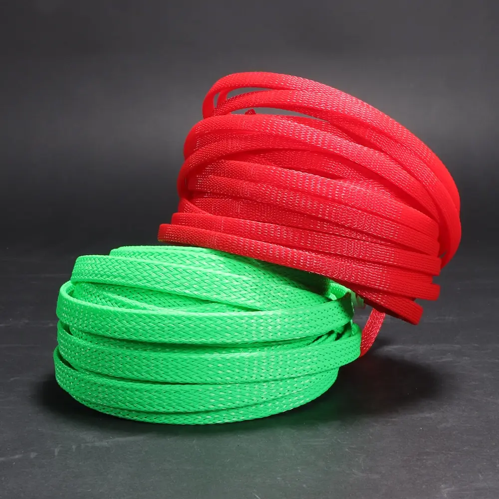 Green and red Braided Sleeving on a black background; Decorative Image